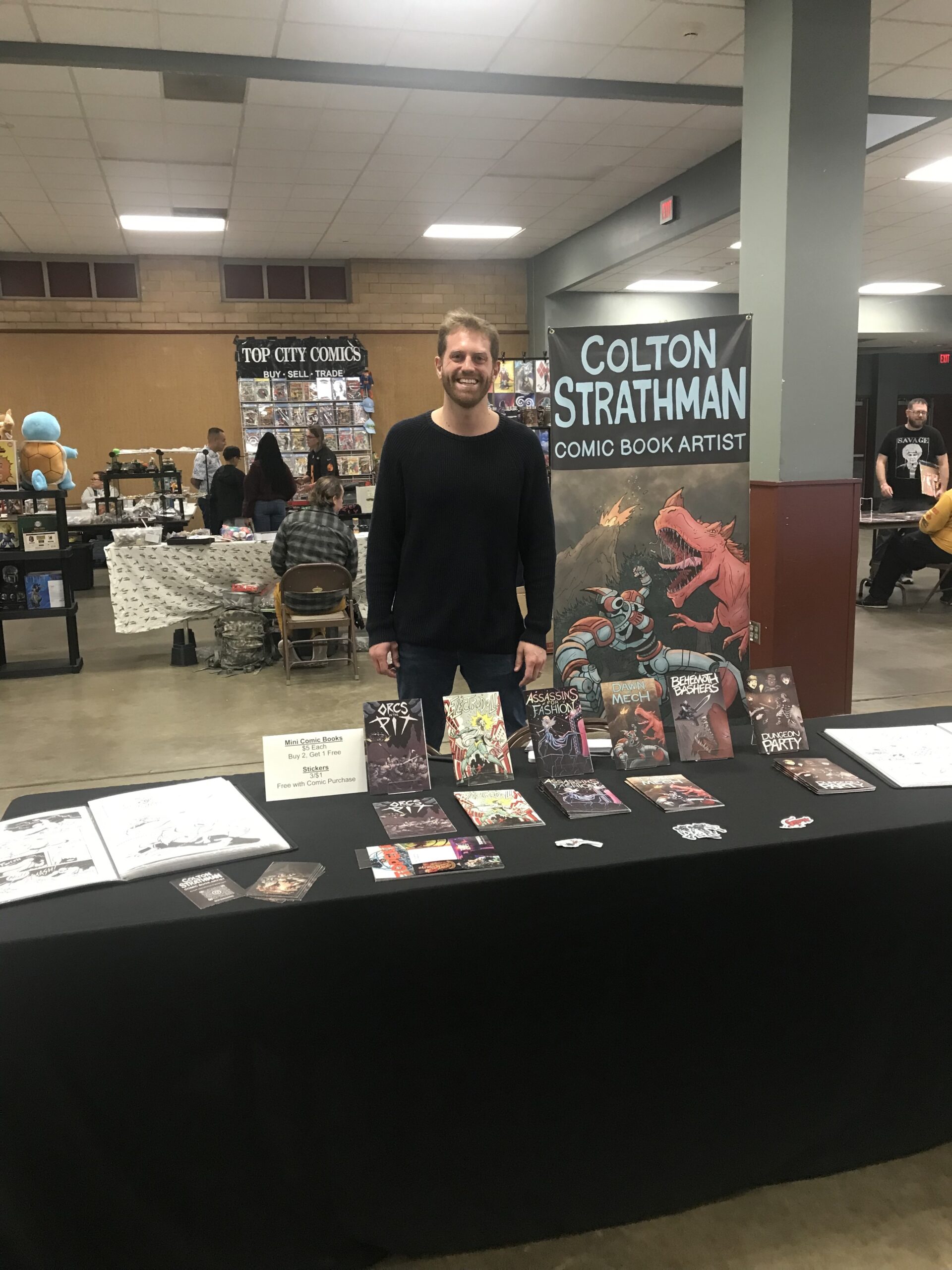 Colton Strathman showcasing his novels and comic books at Topekarama in Topeka