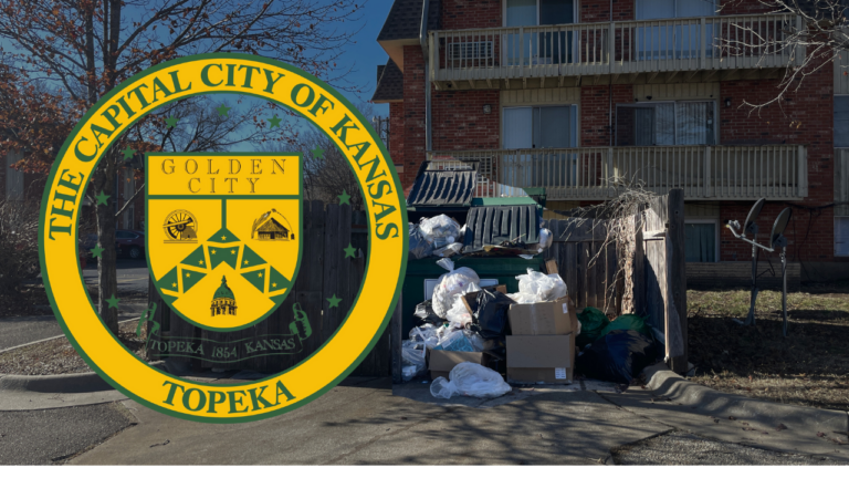 Overflowing dumpster at apartment complex with trash spilling over, creating an unsanitary environment.